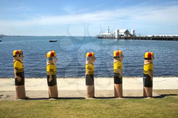 GEELONG, AUSTRALIA - OCTOBER 23, 2016:  Some of the 104 different bollards in Geelong along the baywalk.  All made by Jan Mitchell and represent a chronicle of the city's past.