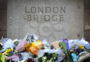 LONDON, UK - JUNE 7, 2017: Floral tributes laid at the site of the London terrorist attack at London Bridge on the 3rd of june 2017.