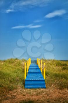 Blue and yellow wooden walkway to nowhere
