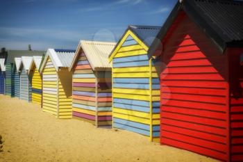 BRIGHTON-AUSTRALIA October 28, 2016:  Colourful  boxes in a row at Brighton beach in Victoria, Australia