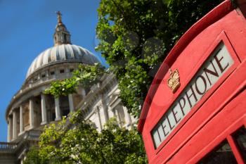 St-Paul's Cathedral and and a corner of a classical red phone box in London UK