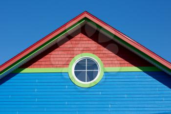 Blue rooftop with round window in Iles de la Madeleine in Canada