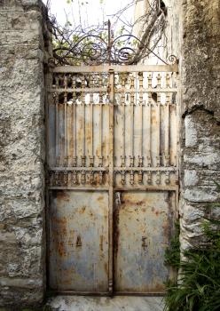 Old grungy and rusty beige gate