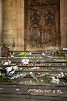 LYON-FRANCE NOVEMBER 15, 2015:  Offerings, toughts, flowers and candles on the steps of the town hall at Lyon, France about the terrorist bombing happens in France on 13th november 2015.