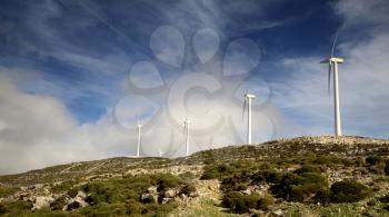 5 wind turbines on a mountains in Naxos, Greece