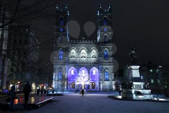 Popular Place d'Armes, Montreal, Quebec, Canada in front of Notre dame Cathedral during winter time in Montreal, Canada