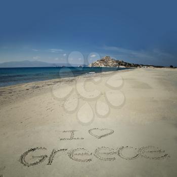 I love greece sign write in sand at Orkos beach in Naxos, Greece