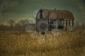 Abandoned barn in a field in Ontario, Canada.  Cross processing to look like an used picture with texture