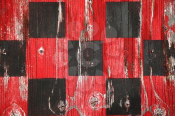 Close up of an old wooden checkers board red and black