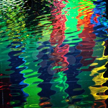 Blue, green, red and yellow reflection into water