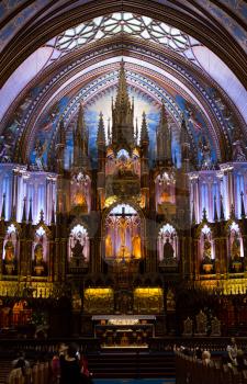 MONTREAL, CANADA - SEPTEMBER 14, 2017:  Nave of Notre Dame Basilica in old Montreal in Canada.  Built in the Gothic Revival style, the church is highly decorated.