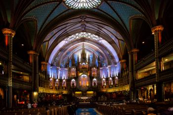 MONTREAL, CANADA - SEPTEMBER 14, 2017:  Nave of Notre Dame Basilica in old Montreal in Canada.  Built in the Gothic Revival style, the church is highly decorated.