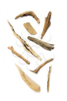 Collection of driftwood, wood that has been washed onto a shore or beach of a sea on white background