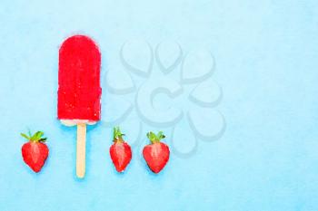 Digital watercolour of strawberry popsicle on a bright pale blue with fresh fruits