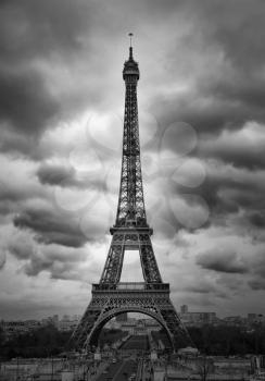 Eiffel tower in a cloudy sky in black and white