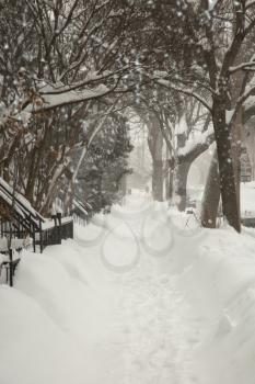 Sidewalk covered of snow  during a snowstorm in Montreal in  Canada
