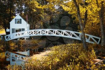 Little white house and wooden bridge at Somesville, Mount desert island, Maine, USA.
