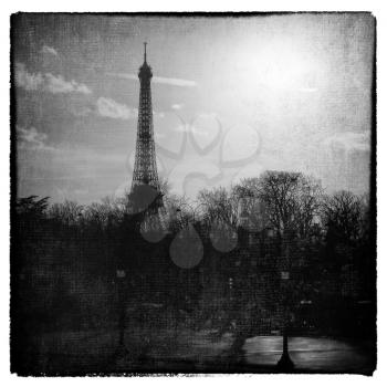 Romantic eiffel tower in sepia with texture to look like and aged and instant picture.