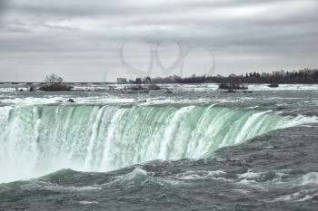 View of the horseshoe falls from canadian border at Niagara falls during winter season