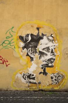 ROMA-ITALY SEPT 26, 2015: Old stencil of a woman on a wall in Roma, Italy