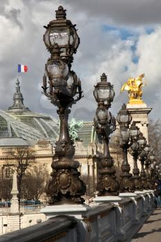 Row of lamp posts on Alexander lll bridge in Paris, France