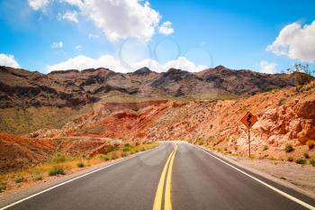 Road to valley of fire with beautiful blue sky full of clouds