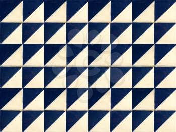 Photographe of traditional portuguese tiles with geometric pattern and in navy blue