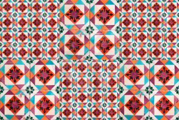 Photographe of traditional portuguese tiles in orange, turquoise and brown