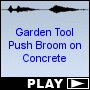 Garden Tool Push Broom on Concrete
